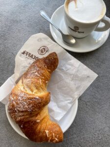 Order a cappuccino and cornetto for Italian breakfast